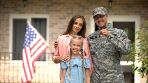 Military man with family showing keys to a rented house in Colorado Springs